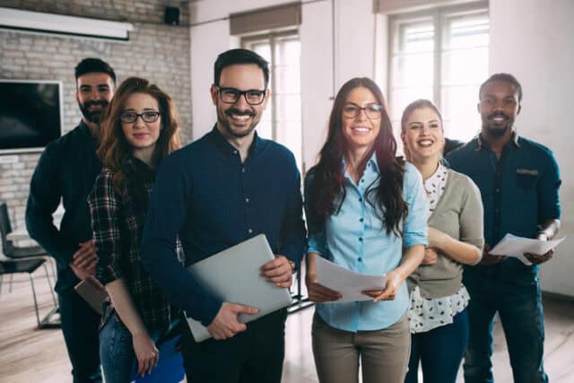 Successful company with happy employees in modern office