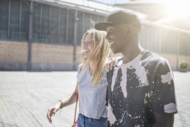 couple walking together in sun