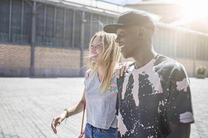 couple walking together in sun