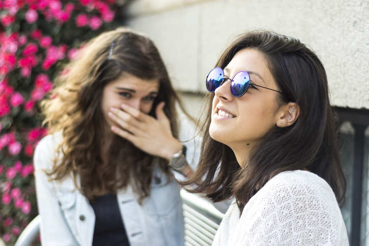 two friends chatting outside