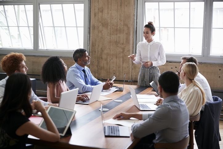 Woman giving business presentation at work.