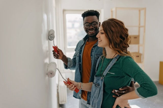 couple painting the wall
