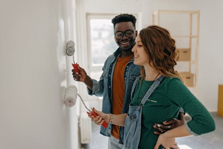 couple painting the wall
