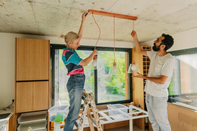 couple hanging lighting in kitchen