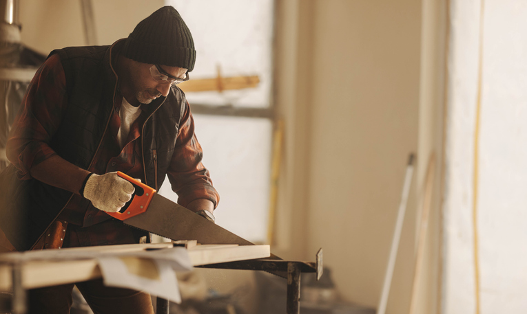 Man sawing in renovation.