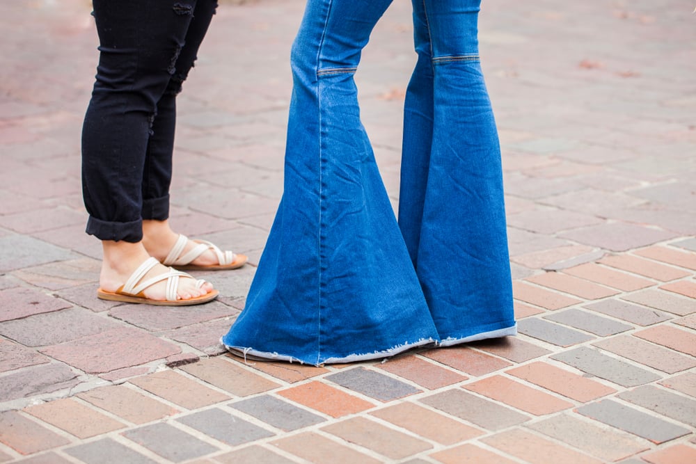 Bell bottom jeans on a fashionable woman.