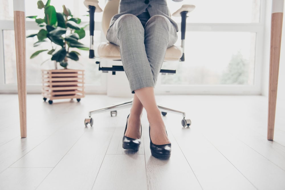 Woman in her office at her desk.
