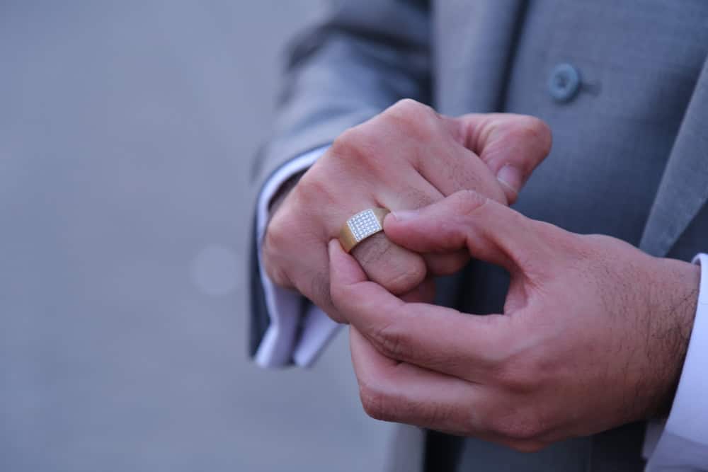 Man removing his wedding band.