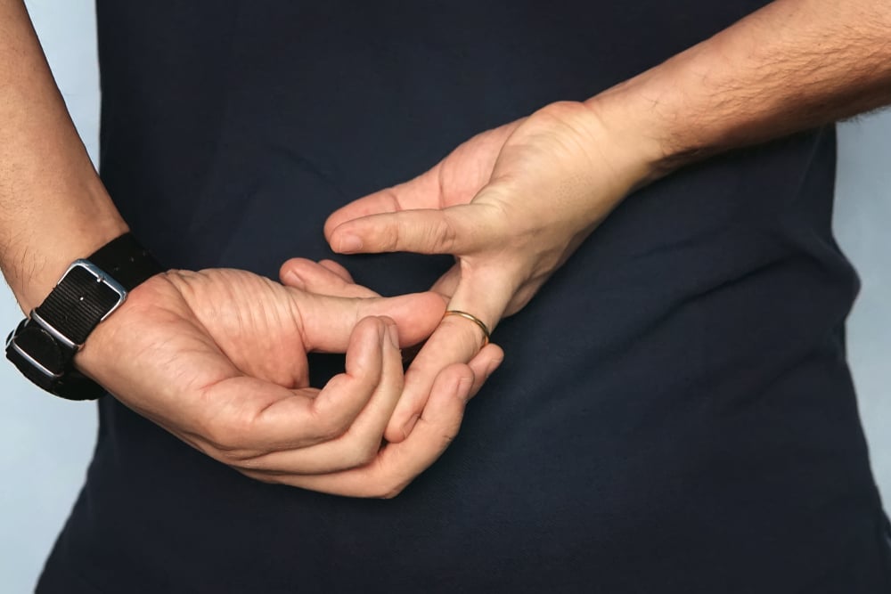 Man taking off his wedding ring.