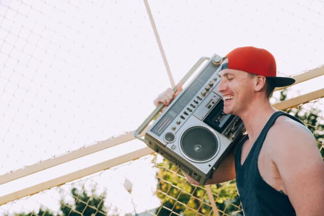 Man holding a boom box.