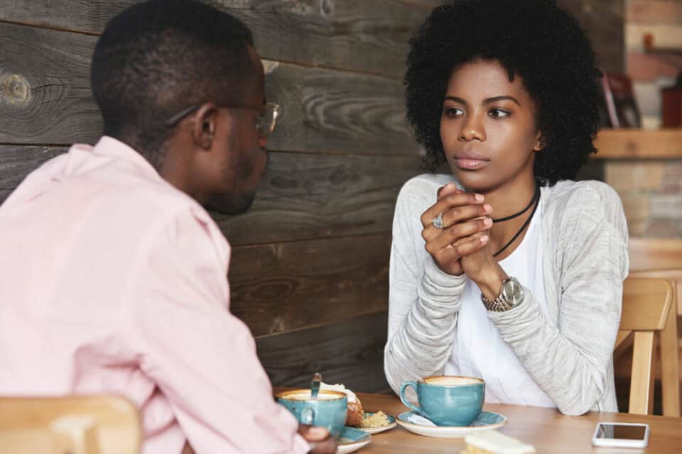 Two people in a serious conversation.