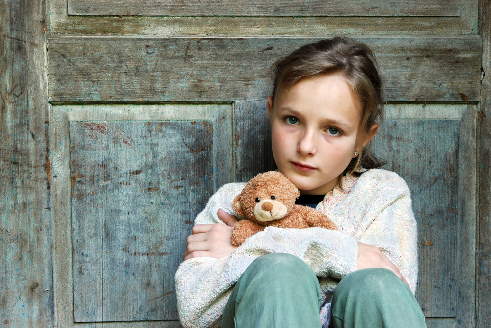 Little girl sitting alone.