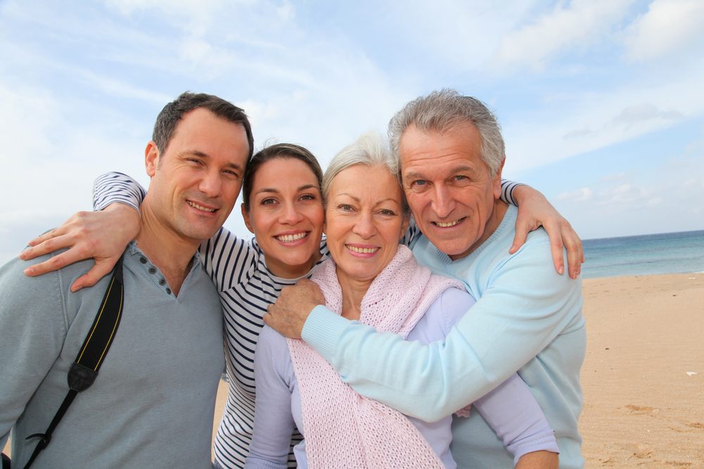 Family with their parents on the beach.
