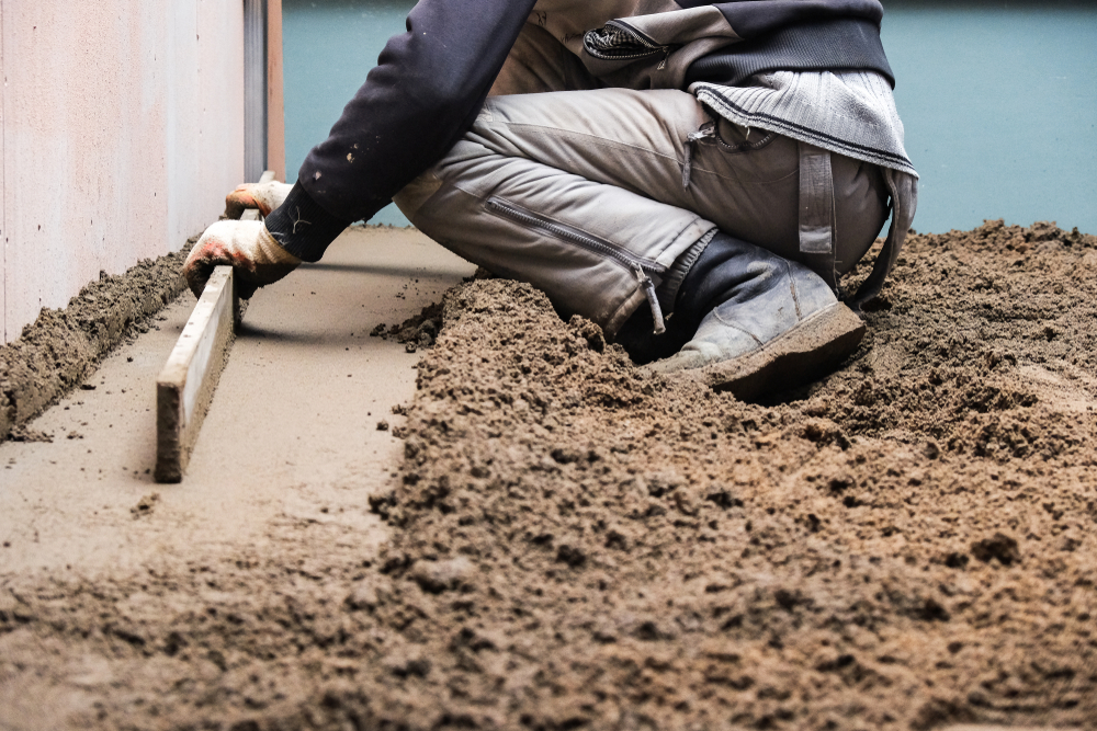 Man pouring a concrete slab