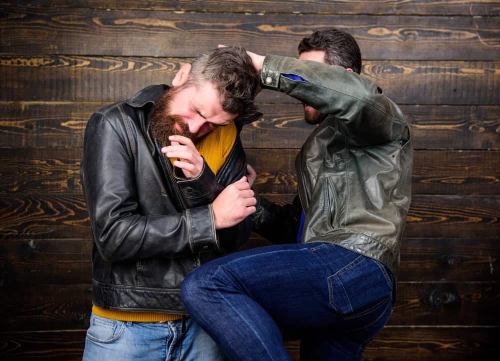 Two men in a street fight.