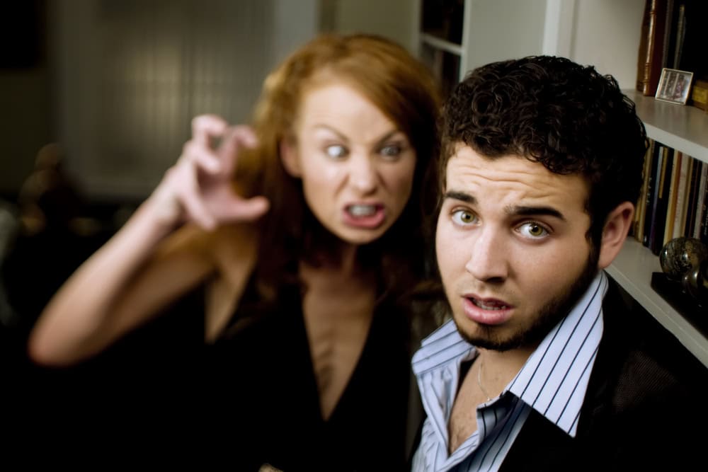 Woman encroaching on a man's personal space.