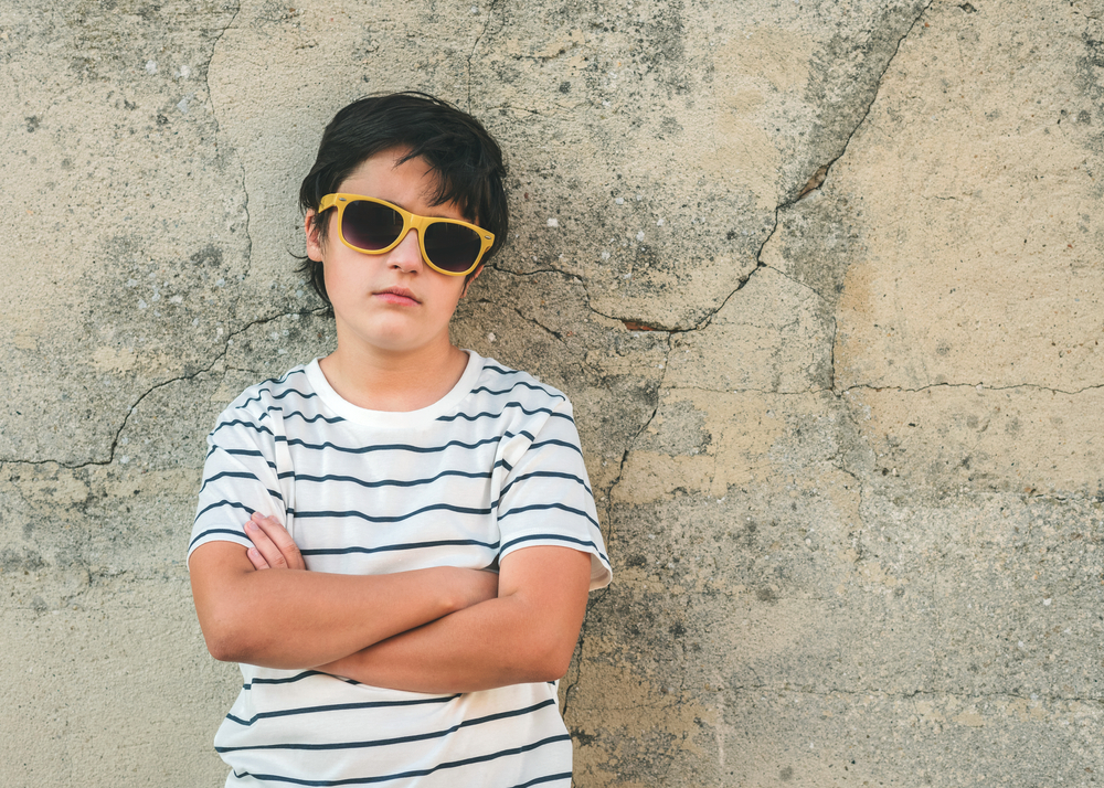 Boy with sunglasses on.