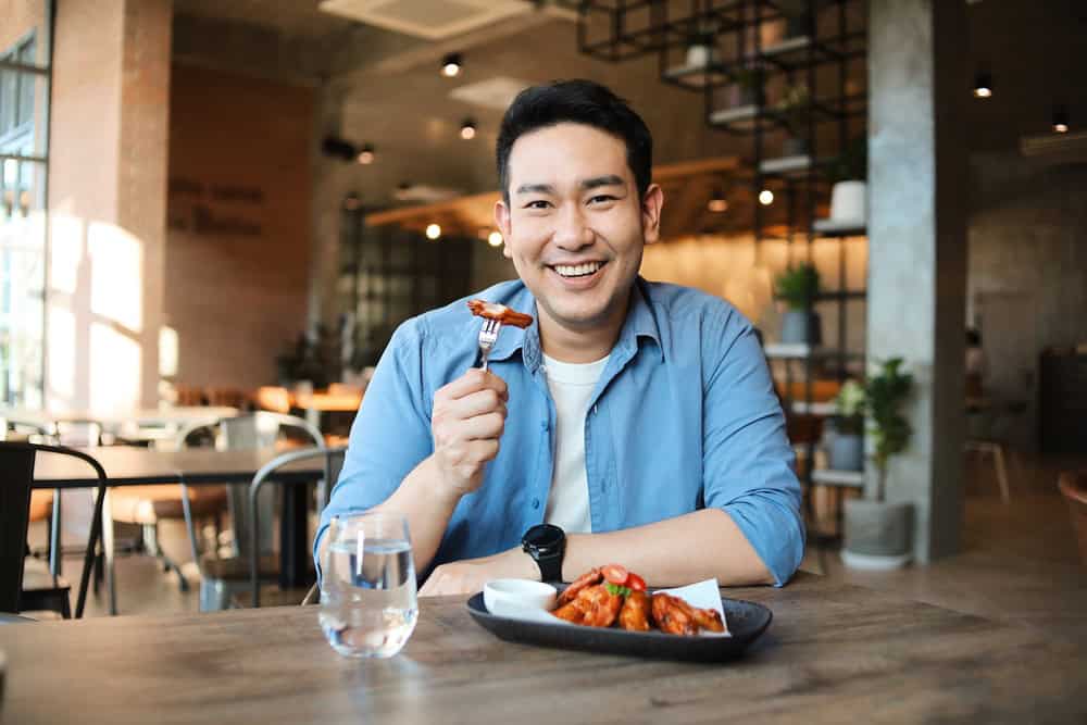 Young man eating out alone. 
