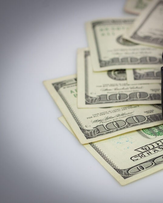 $100 bills on a table.