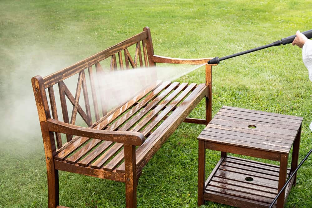 Cleaning outdoor furniture.