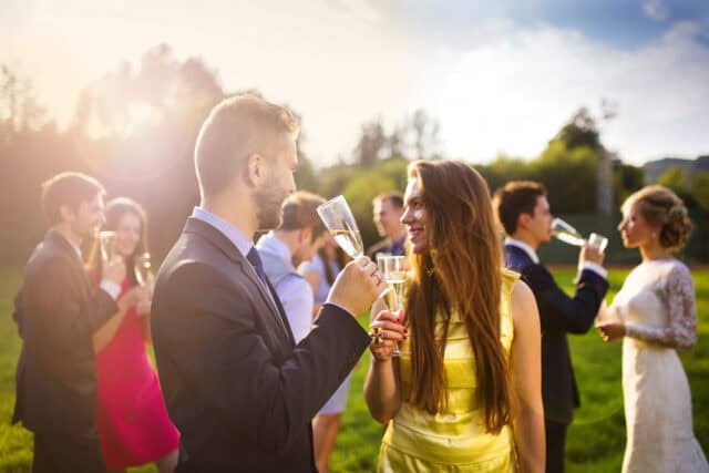 Guests clinking champagne glasses.