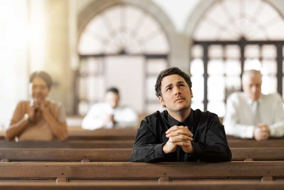 Man praying at church.