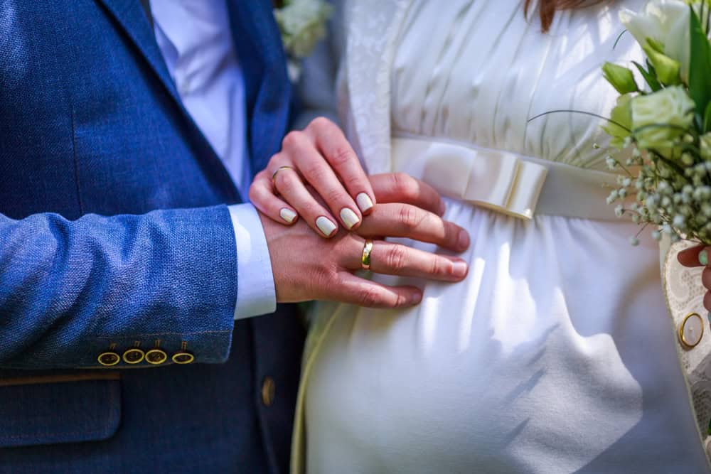 Hands with wedding rings. 