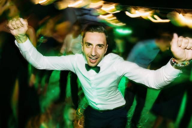 Man dancing in a tuxedo.