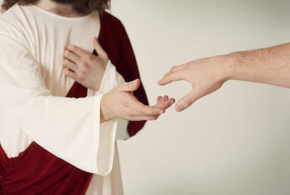Jesus with an outreached hand.