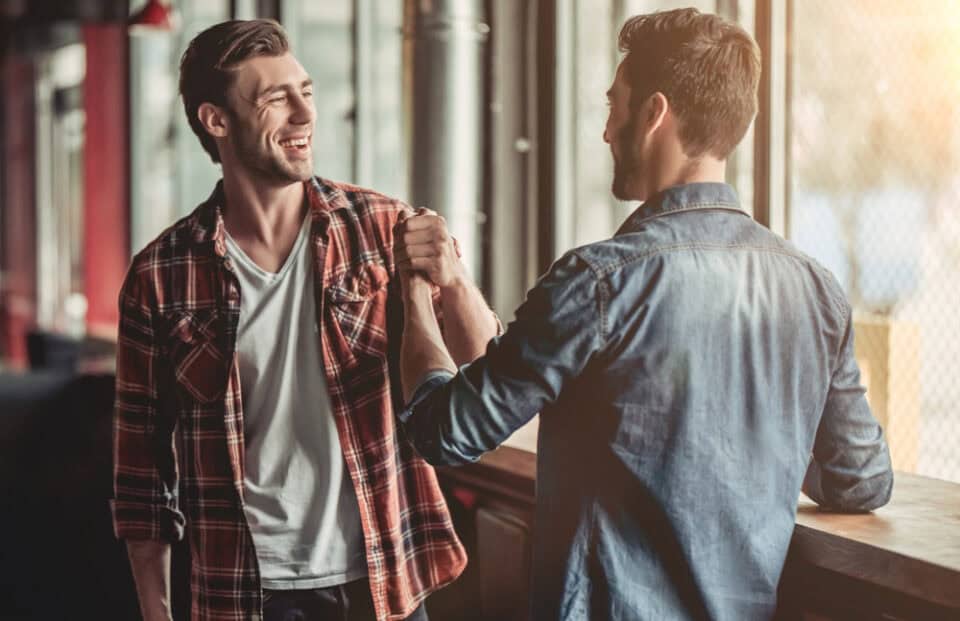 Two men shaking hands.