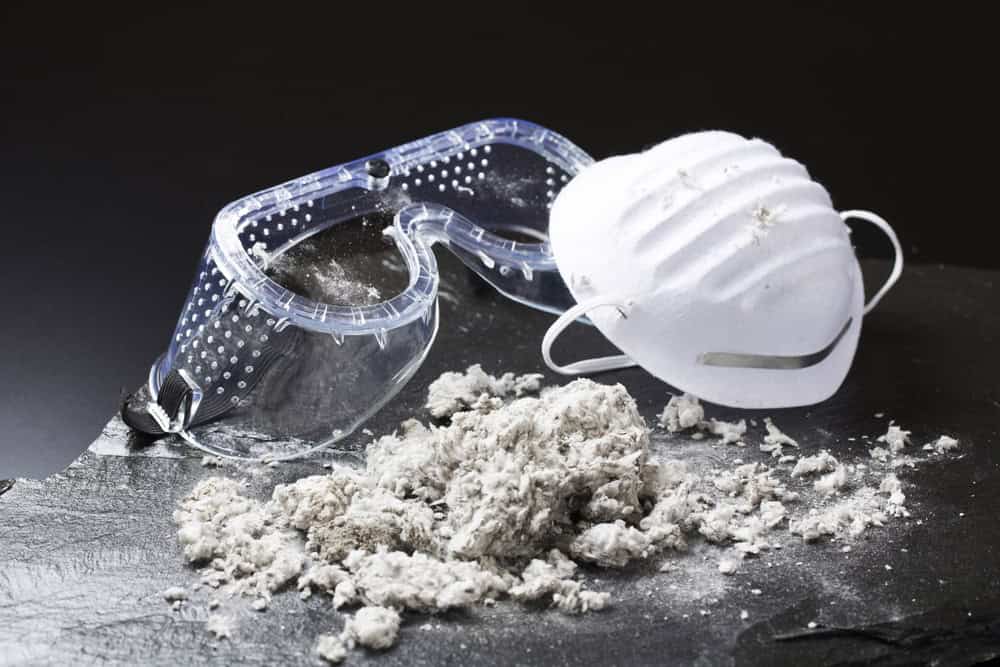 Asbestos with work goggles and a mask.