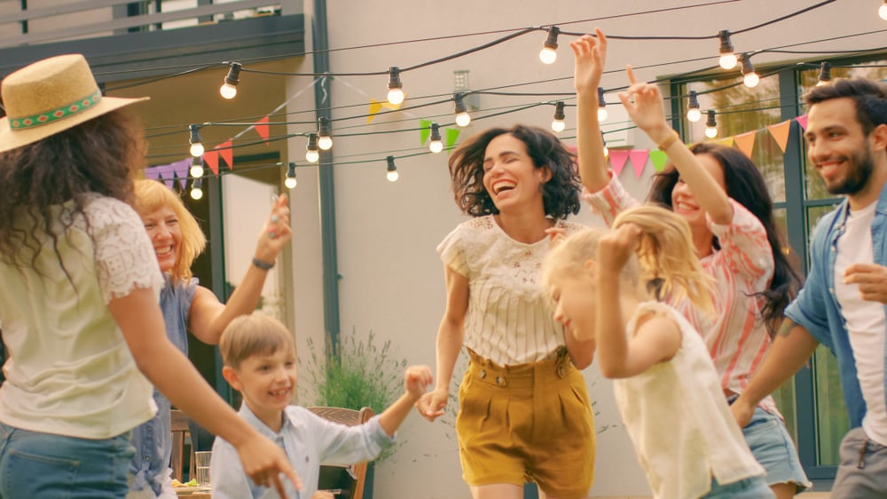 Family and friends dancing together.