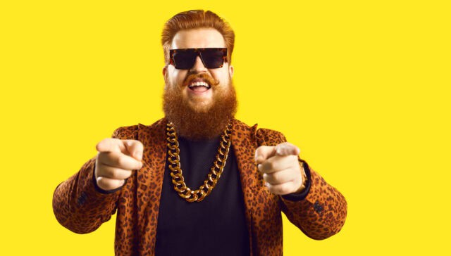 Happy guy in a large gold necklace.