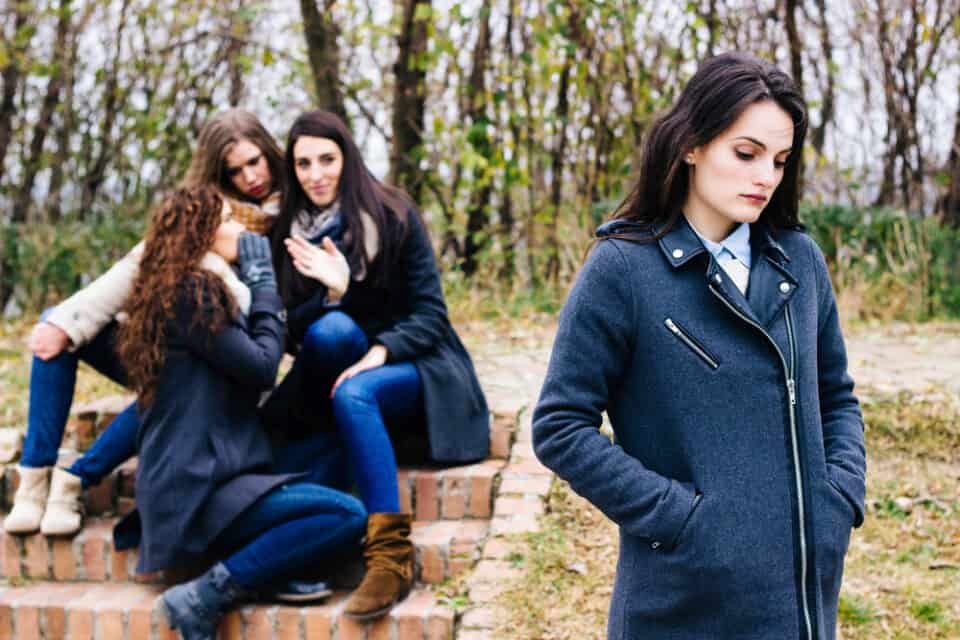 Sad girl with a group of friends.