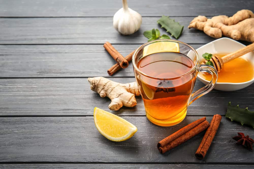 Hot tea with honey and lemon.