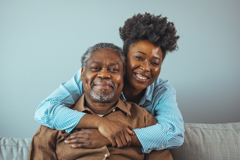 Father and daughter laughing together.