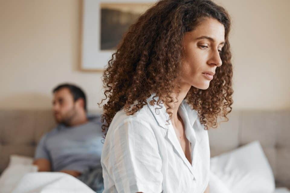 Husband and wife in bed.
