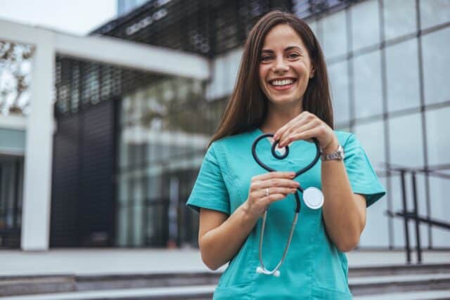 nurse holding stethoscope.