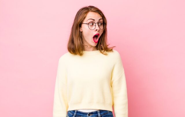 Pretty young women looking shocked and su
