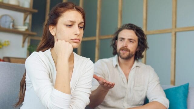 Couple not speaking to one another.