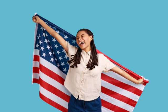 Woman holding an American flag.