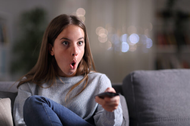 Woman watching TV.