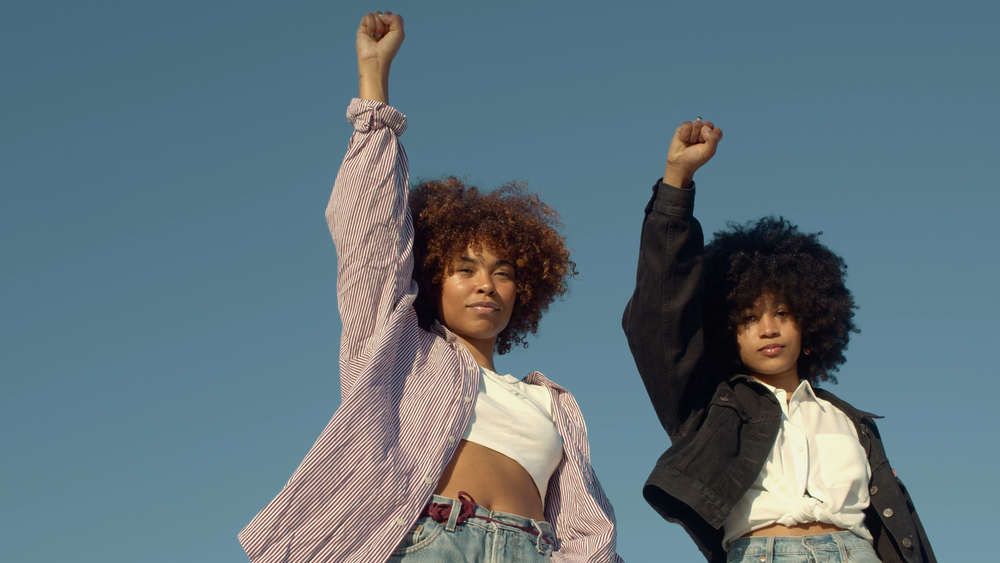 Two young woman on a march.