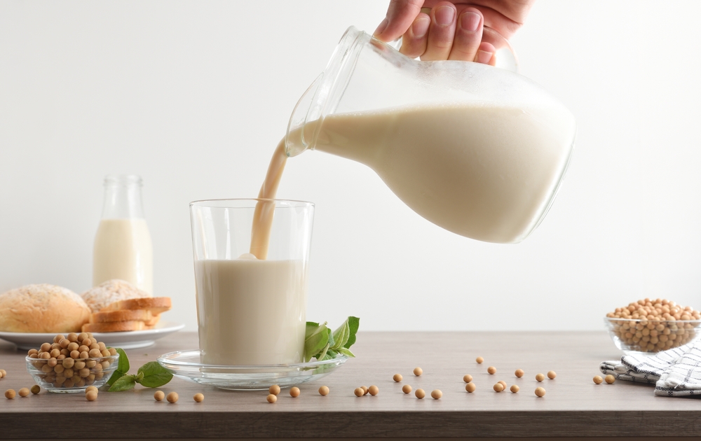 Filling a glass with milk.