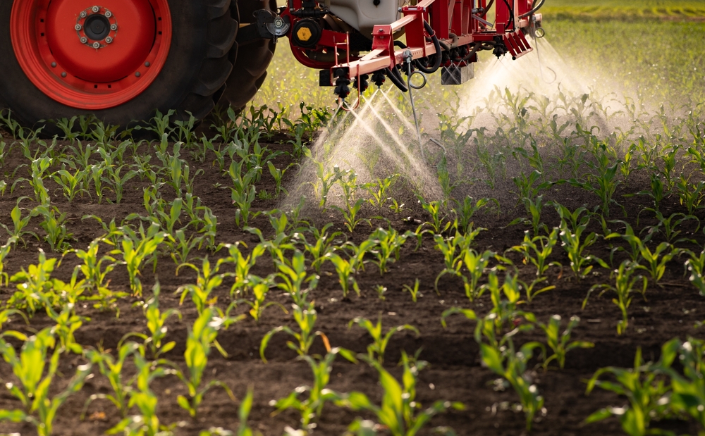 Tractor spraying pesticide.