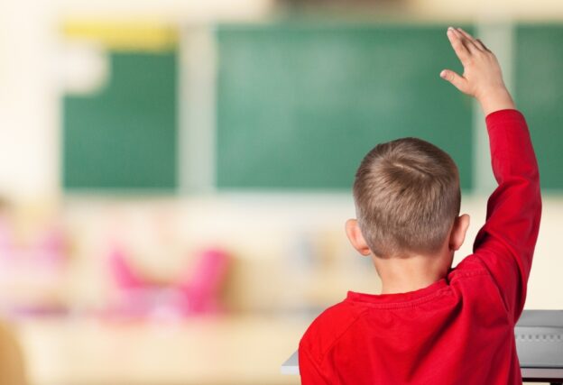 Child sitting in a classroom.