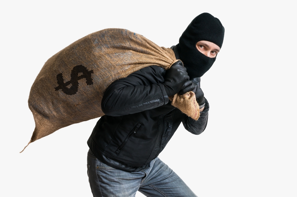 Man with a sack of money on this back.