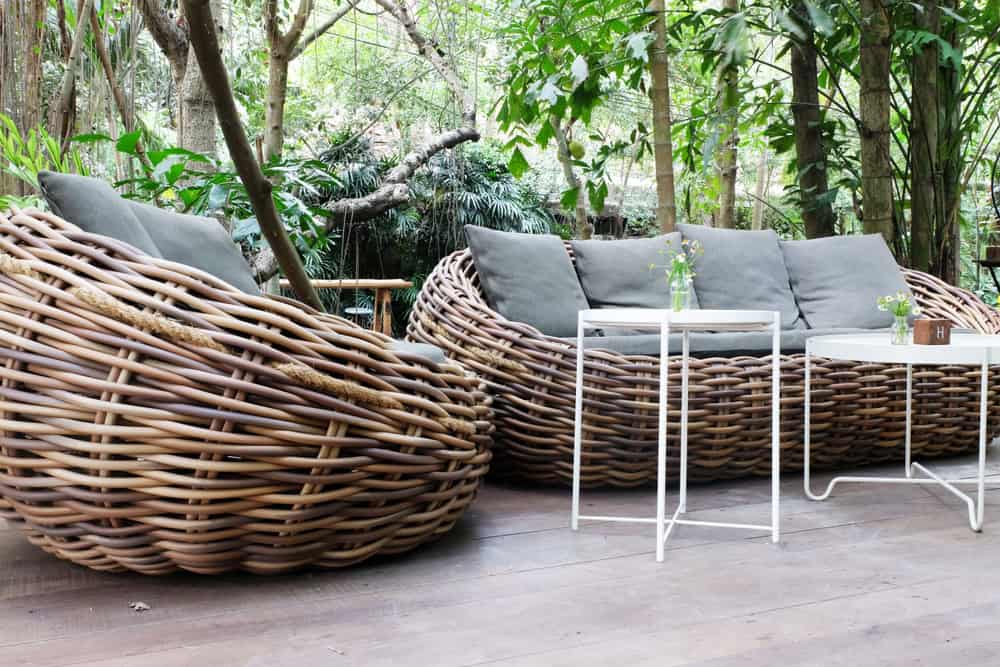 Rattan sofas on a porch.