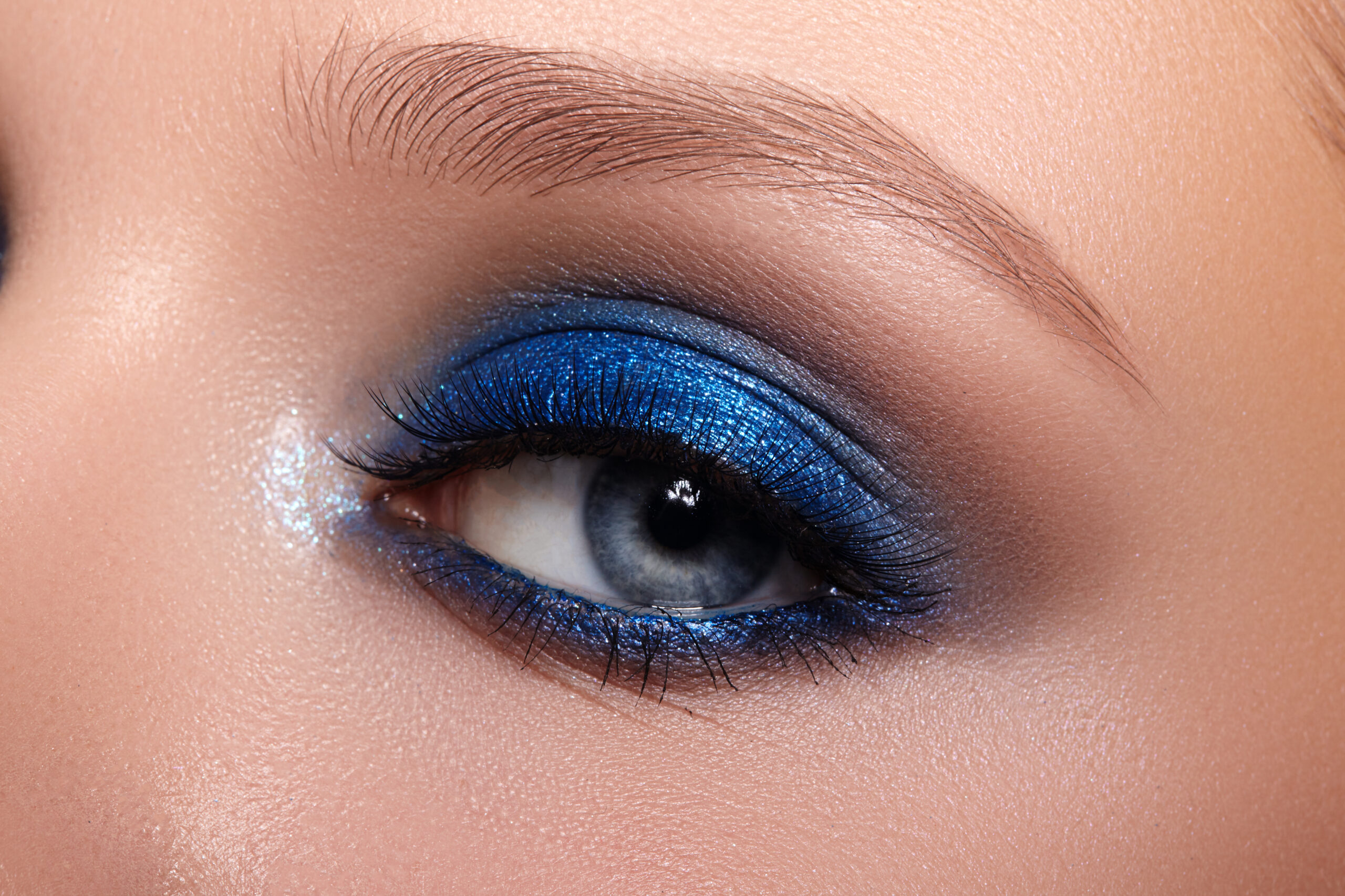 Woman with heavy blue eyeshadow.