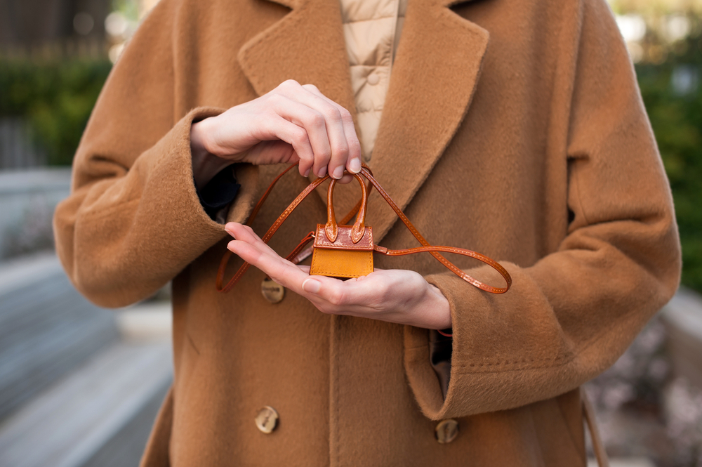 Woman stylish in brown tailored jacket.